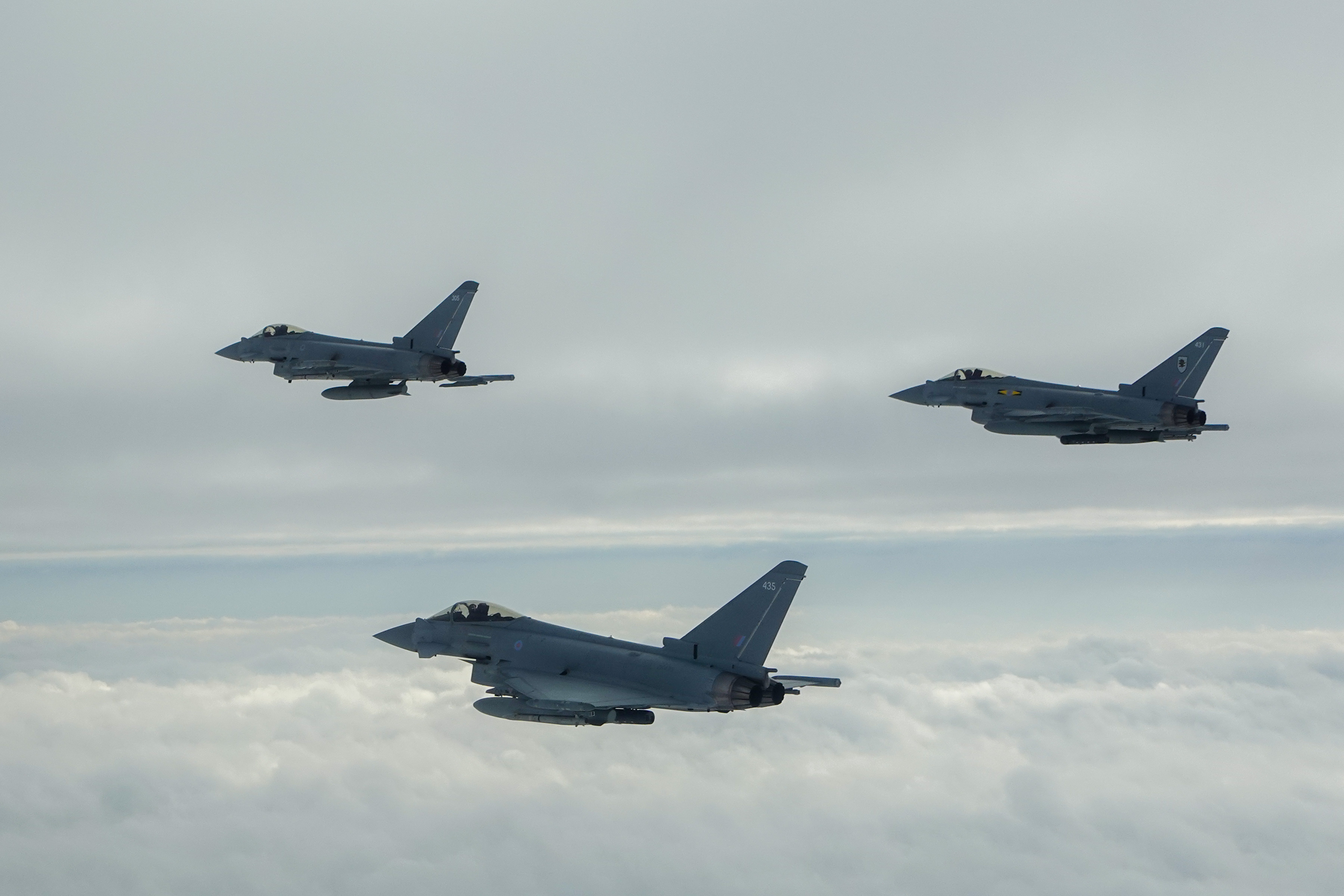Three Typhoons in flight.